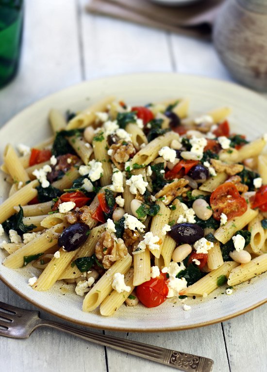 Greek-style pasta with white beans, walnuts, spinach and olives