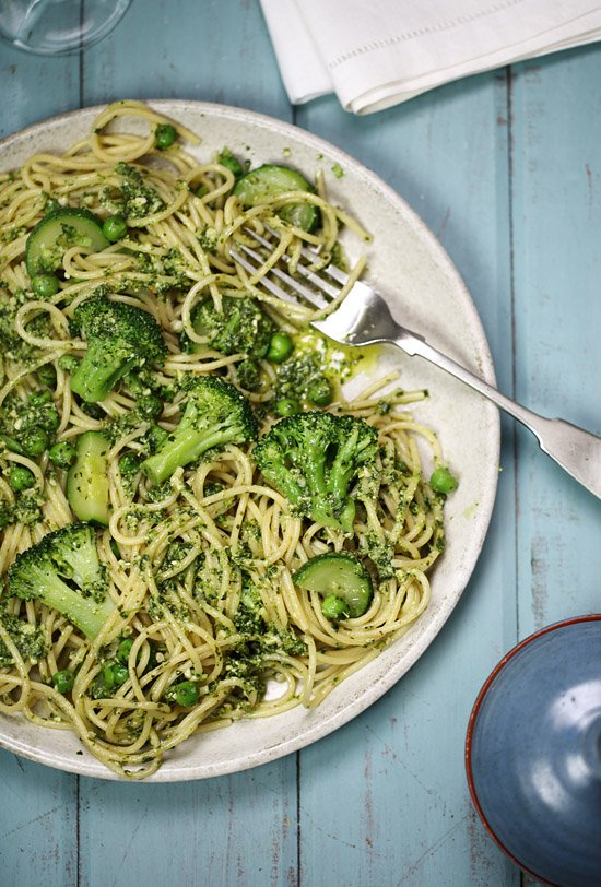 Basil and almond pesto pasta with broccoli, peas and zucchini