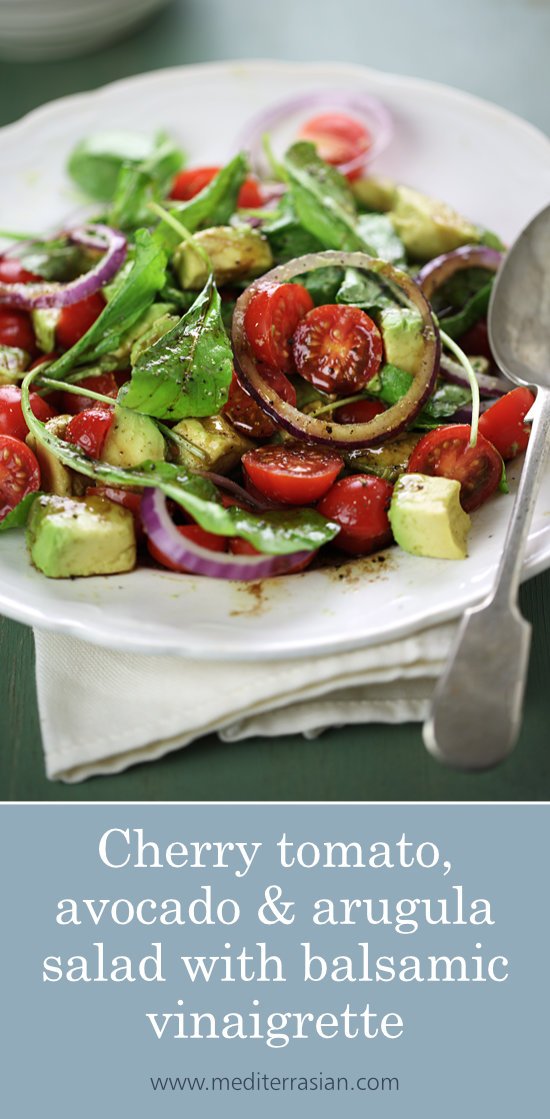 Cherry tomato, avocado and arugula salad with balsamic vinaigrette Cherry tomato, avocado and arugula salad with balsamic vinaigrette